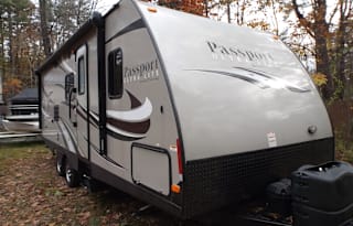 2015 Keystone Passport travel trailer sleeps 6 with all the comforts of home, fun for the whole family.