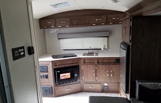 This trailer is Ultra lite and towable by almost any SUV or small pickup truck. Sleeps 4 and only weights 3,000lbs. Has a small slide out, U shaped dinette. Fully self contained. All the basic RV needs. Includes a outside bbq power awning and more...