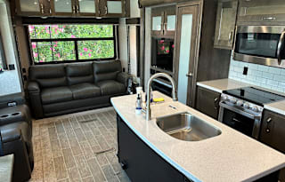 Turn Key stocked 38' upgraded unit sleeps four.