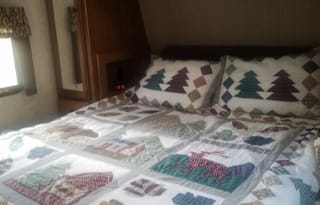 Pet Friendly RV Rental w/outdoor kitchen with stove, grill, fridge, sink. Sleeps 4-6.
