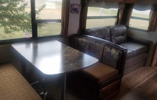 Pet Friendly RV Rental w/outdoor kitchen with stove, grill, fridge, sink. Sleeps 4-6.