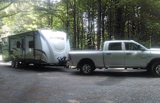 Pet Friendly RV Rental w/outdoor kitchen with stove, grill, fridge, sink. Sleeps 4-6.
