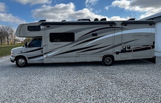 Max Mileage, Off Grid Solar, sleeps 8, 2 slides;