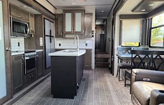 Turn Key stocked 38' upgraded unit sleeps four.