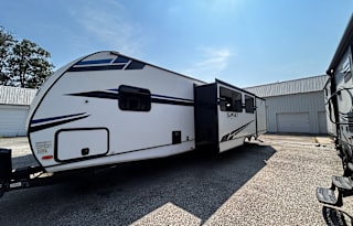 #24_Trailer w/ king, bed 4 bunks & outside kitchen