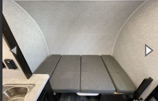 Yes it has a bathroom. Small easy to tow 3200lbs.