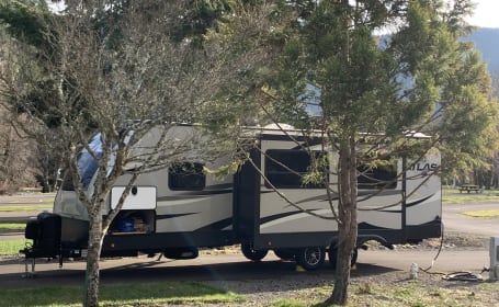 WE HAUL!  2019 Dutchmen Atlas with outdoor kitchen, lots of amenities & fully stocked!