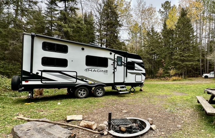 The 2022 Imagine XLS 21BHE is ideal for boondocking with solar panel prep, large freshwater tanks, oversized holding tanks, and rugged off-road tires for remote adventures.