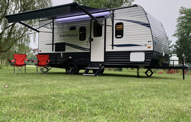 Motorized awning for shade & LED lights for evening.