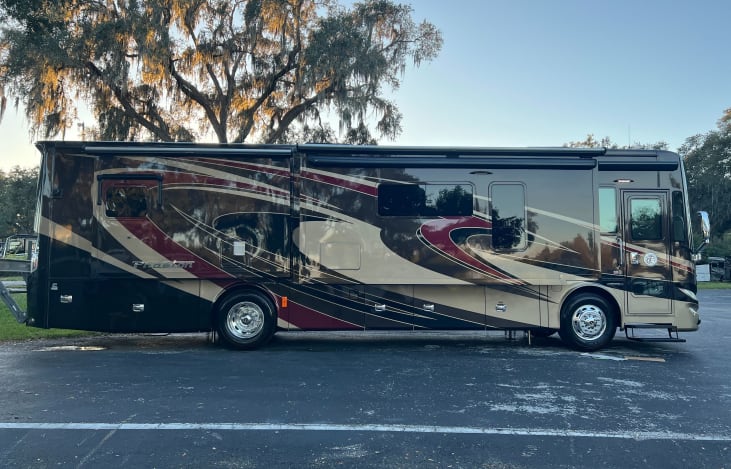 The Tiffin 36GH is an RV with two slide outs on the passenger side, offering enhanced living space and luxury for travelers. This design ensures maximum comfort and convenience on the road.