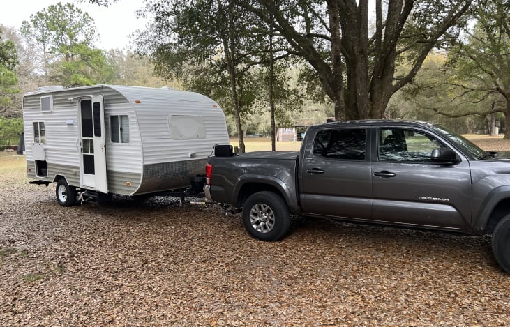 The camper trailer is a perfect size for a small family. It open floor plan and windows make the small space feel spacious.