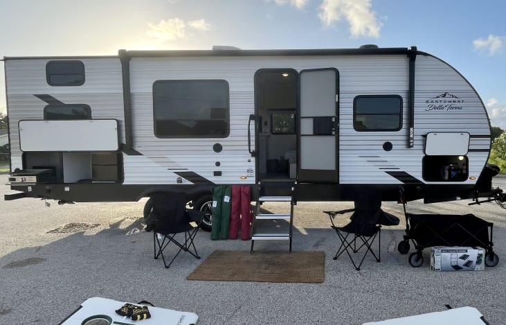 Camper loaded with everything you could need for a relaxing vacation. We include 6 chairs, a wagon to haul your gear, and multiple outdoor games!
