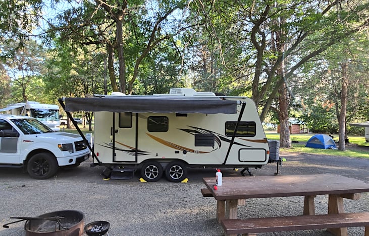 This picture is from a late June 2025 on a five day stay at Hell's Gate State Park.  Having the awning and air conditioning was a life-saver as temperatures for three days were 101-105.