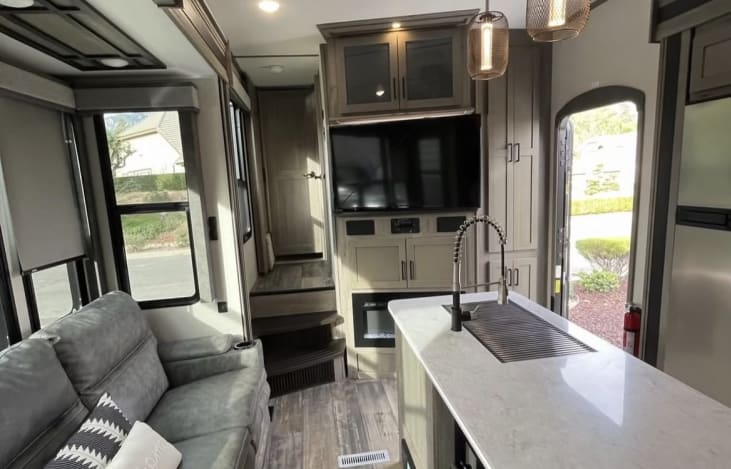 Entertainment center, electric fireplace, and sound system for speakers inside, out or both!