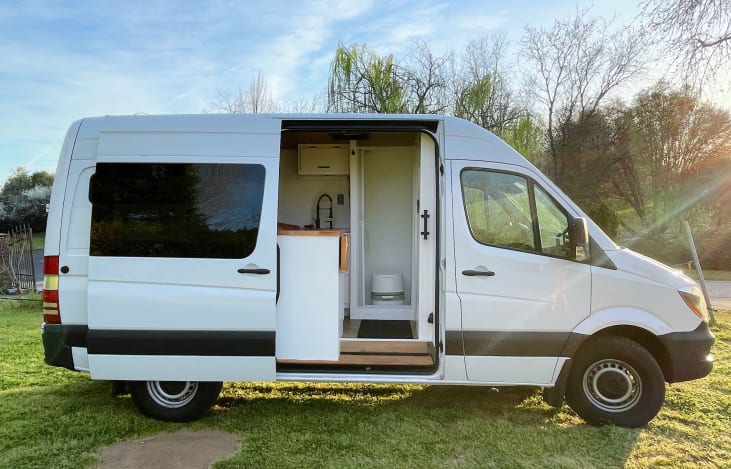 This van allows for the full RV style experience (private bathroom, near king bed, stovetop) in an easier to drive/park vehicle.