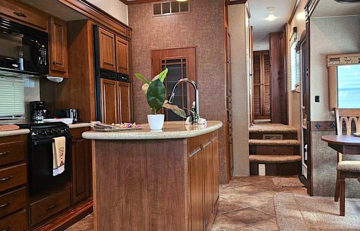 FRONT AREA with dining, kitchen, and hallway view