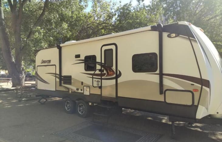 Exterior of Trailer, has large outdoor Kitchen