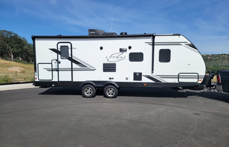 Bottom left corner is the outdoor kitchen and mini-fridge (and a leash attachment point for pups), and the bottom right is the pass-through storage