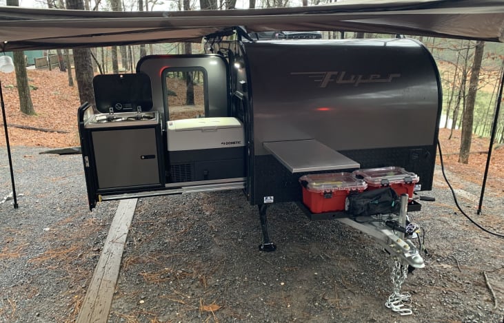 View of the kitchen setup, dual burner stove, and Dometic freezer/fridge