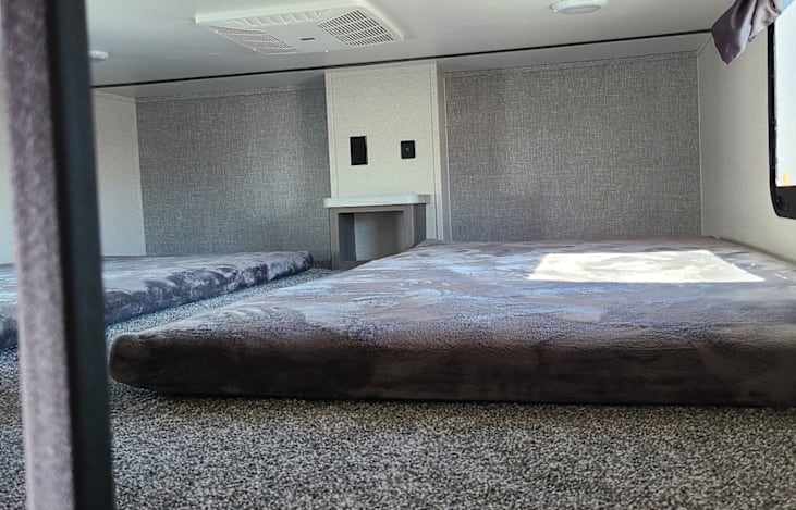 Upstairs bedroom that sleeps 2 on twin beds. Mattresses are updated to your standard twin mattress rather than the RV mats show in picture