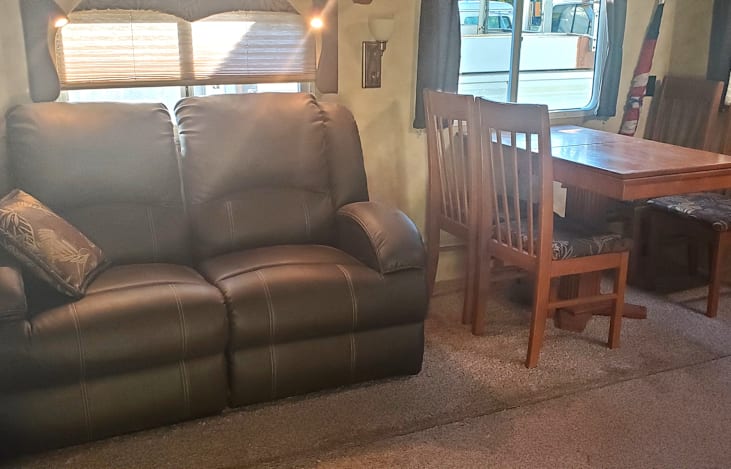 The couch forms a relaxing place to read, watch movies, or listen to the radio.