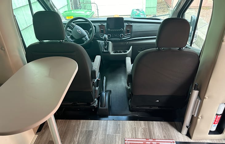 Two captain chairs for a smooth, comfortable ride with large screen navigation and Apple Car Play.