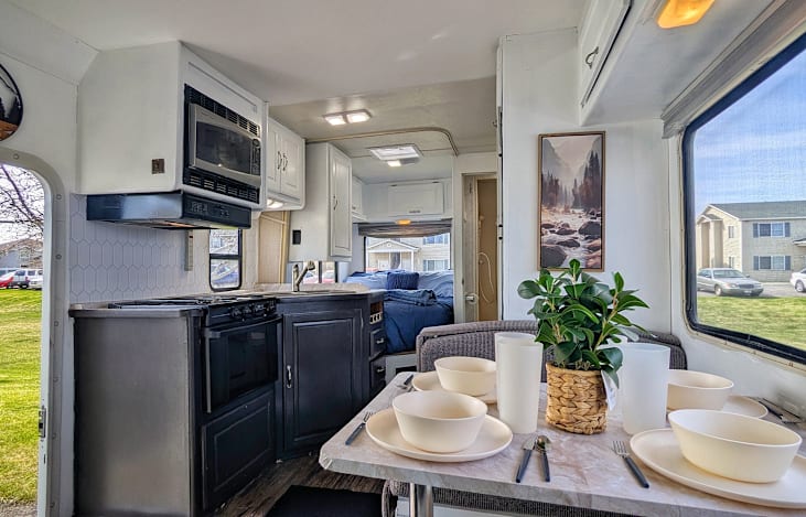 The gas stove and oven combo, along with the microwave, spacious counters and a large sink, and the included outdoor grill ensure that your family dinners are healthy and tasty