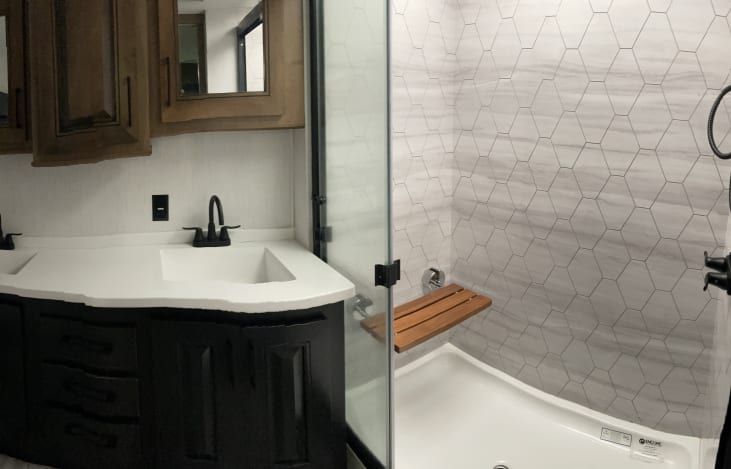 Master bath has two sinks and nice shower