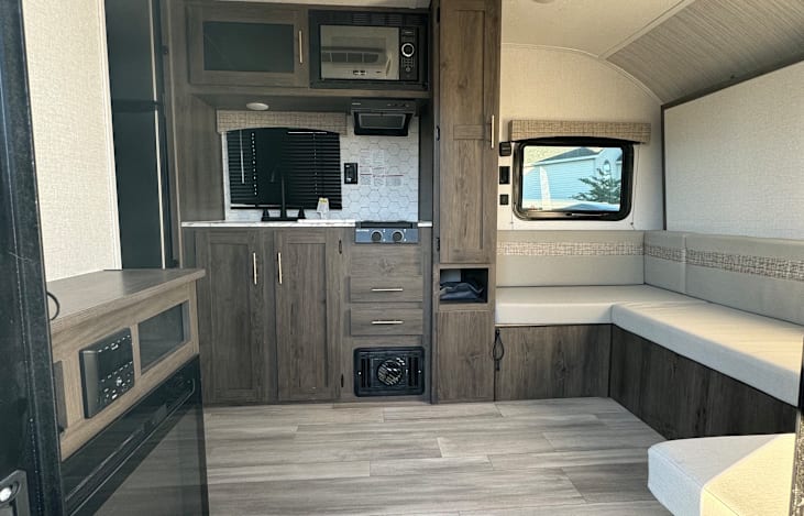 The lounge area is a flexible living space that can be converted to a dining area or the main sleeping space with a murphy bed.

There is an electric fire place that makes this area feel very cozy!