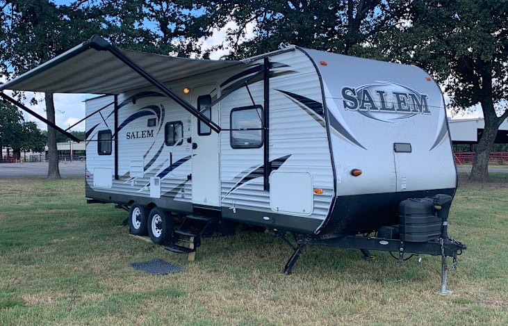 Front of rv with awning extended.