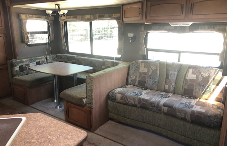 Both the sofa and dinette turn into beds.