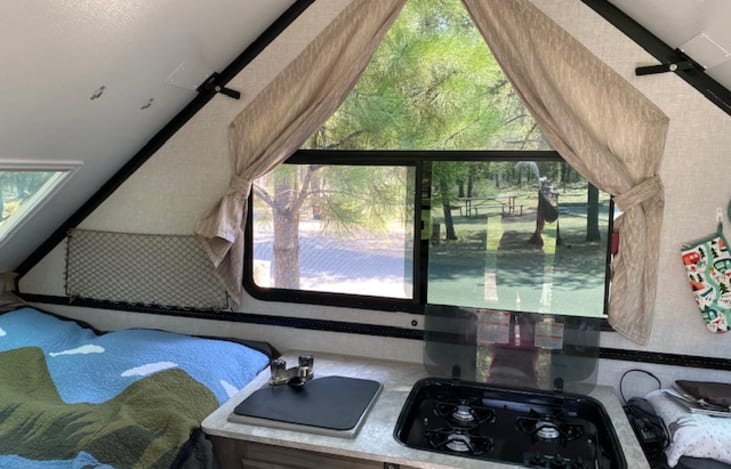 6 windows with 3 that open make for a wide open feeling with breeze. Ceiling fan also helps for warm days.