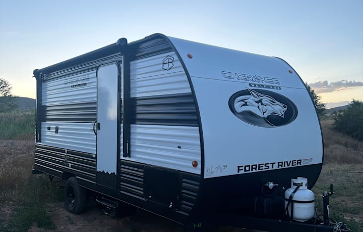 Exterior photo. Awning and propane tank included.