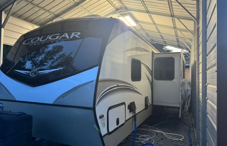Back side includes water hookups and storage.