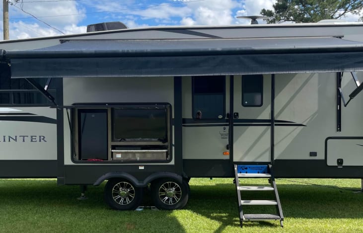 Outdoor fridge, two burner stovetop and tv