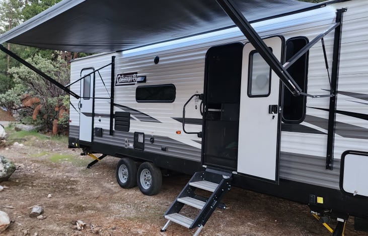 Trailer with awning , upgraded steps & screen door
