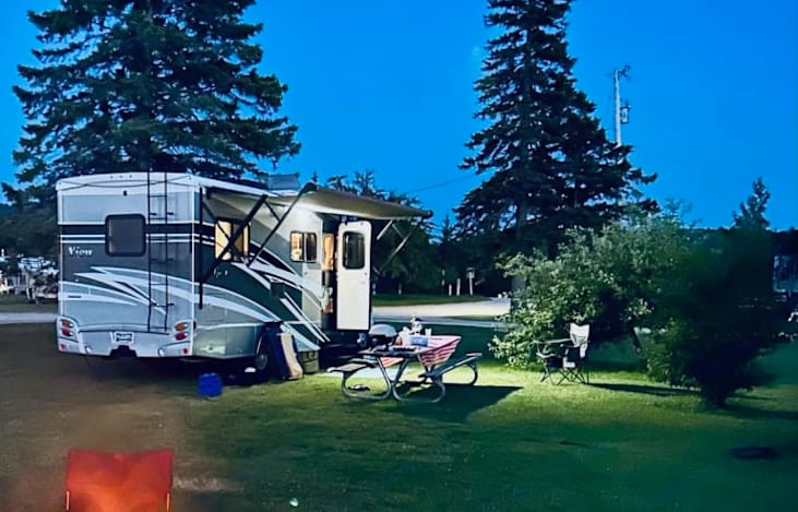 Camping at it's best! Campfire and picnic table set up.