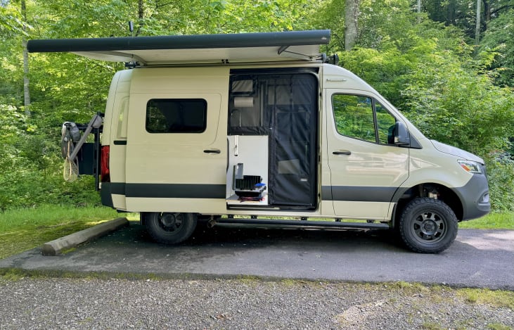 Passenger side, awning and door open.