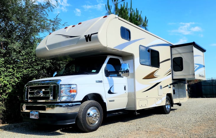 24' RV which is the perfect size for all national parks. Queen bedroom slideout with walkaround bed.
