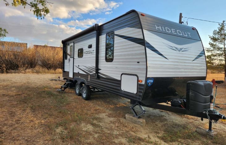 2020 Hideout RV with full propane tanks, auto retractable awning, LED exterior lights, and exterior speakers for a guaranteed good time!