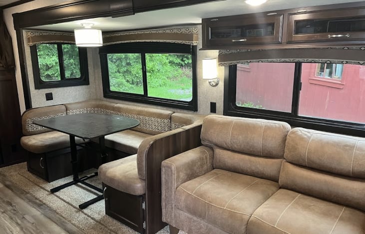Horseshoe Dinette and couch slide out to create a lot of space for a rainy day!