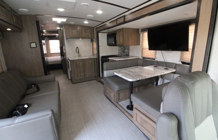 BEST floor plan for dinner, hang-out, board games, and it's hard to find! Most RVs have the couch and table on the same wall.