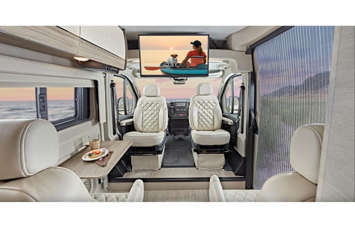 Sleeps 2 (rear convertible bed) & seatbelts for 4. Has 2 Flat-screen TV's, Bluetooth sound system, and USB charging ports.