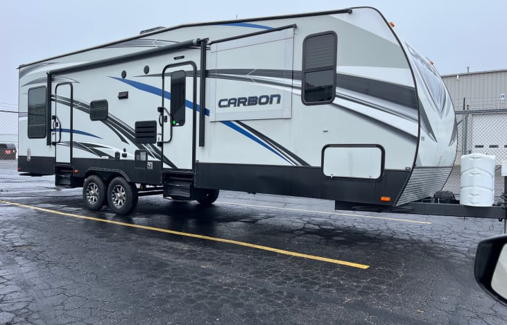 Large Spacious and Clean Camper with 2 Slides, Electric Awning, LED Lighting, Upper Rear Bunk, Rear Ramp door access for wheelchairs, and an onboard generator if in an area without electricity!
