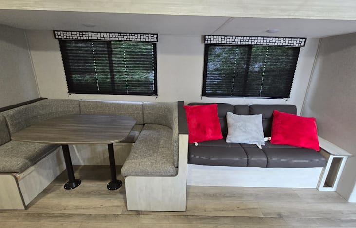 Couch and dinette. Both turn into additional sleeping spaces.
