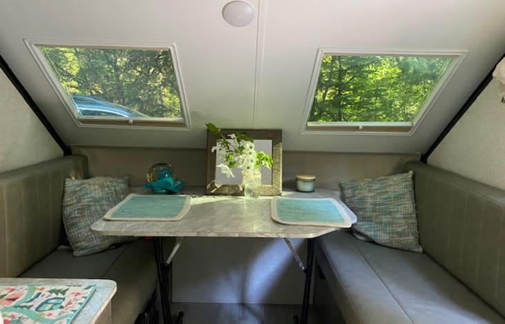 Dinning area makes into bed.