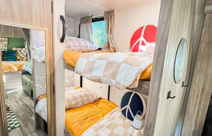 Private bunks with under bed storage accessible from the inside and the outside