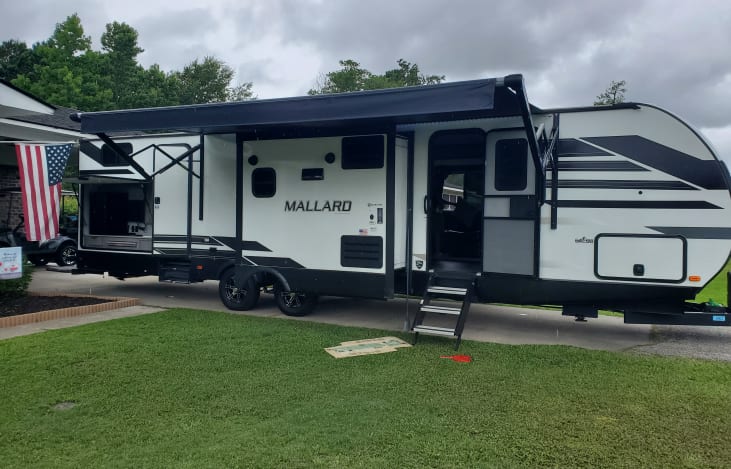 Two bed rooms. Master with king size bed with storage space. A bunk room that can sleep 4 kids or 3 adults. Outdoor speakers with LED lights on the front of the camper and along the side of the awning