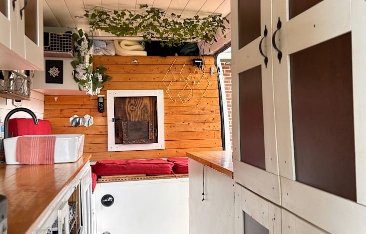 To the right is the doors to the closet. Drawers or kitchen utensils to the left.