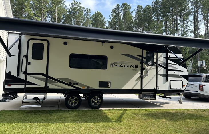 Large awning with led lighting, 2 entrances one for master bedroom and main areas. Outdoor Bluetooth speakers so you can bring the fun outside as well!